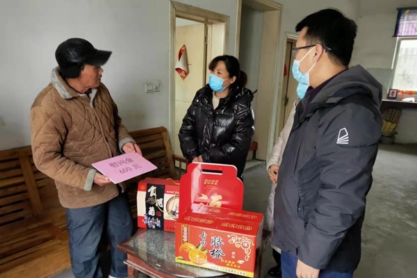 三合镇开展春节慰问计生困难家庭活动